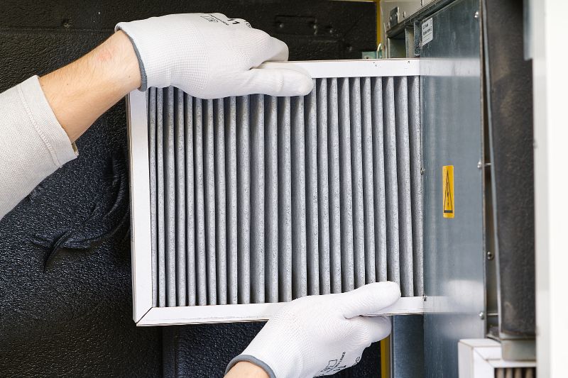 4 Reasons to Replace Your Home’s Air Filter - Technician Changing Air Filter.